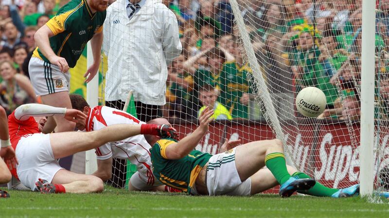 Sheridan throws the ball over the line to secure the title for Meath. Photo: Donall Farmer/Inpho