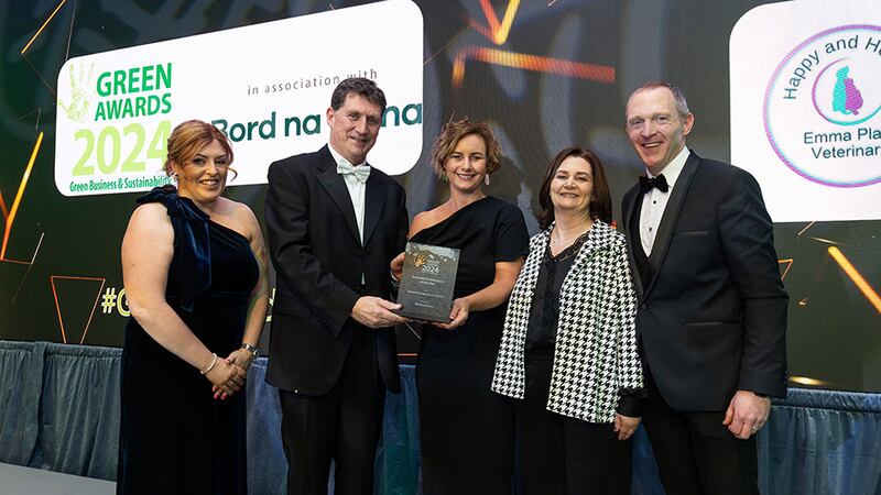 Sharon Doyle, HR and corporate affairs, Bord na Móna and Minister Eamon Ryan present the green micro enterprise of the year to Emma Plant and Veterinary Practice team