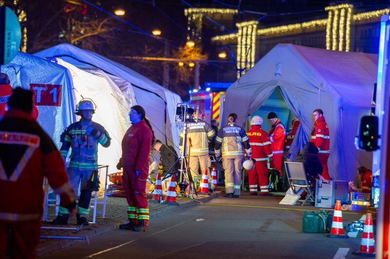 Emergency personnel work at the scene of the attack. Photograph: Craig Stennett/Getty Images
