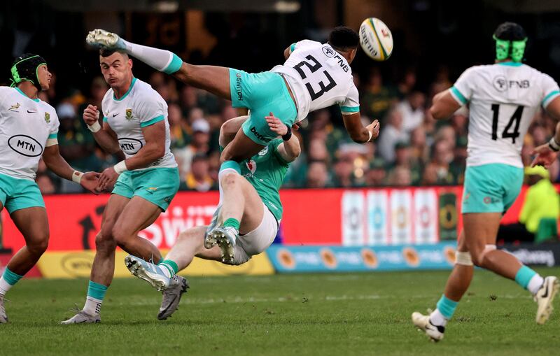 Ireland's Jamie Osborne and South Africa's Sacha Feinberg-Mngomezulu in action during the second Test in Durban. Photograph: Dan Sheridan/Inpho
