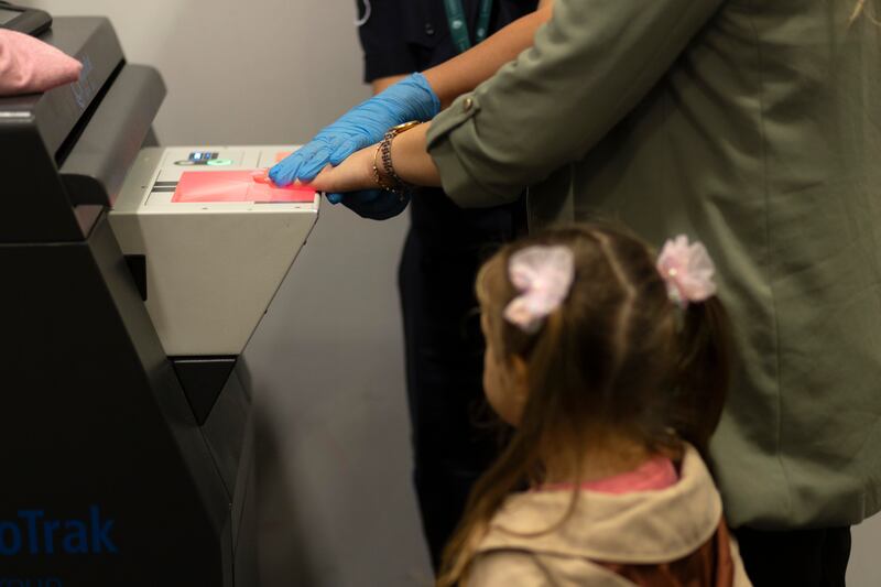 A woman is fingerprinted after an immigration check at Dublin Airport. Photograph: Chris Maddaloni