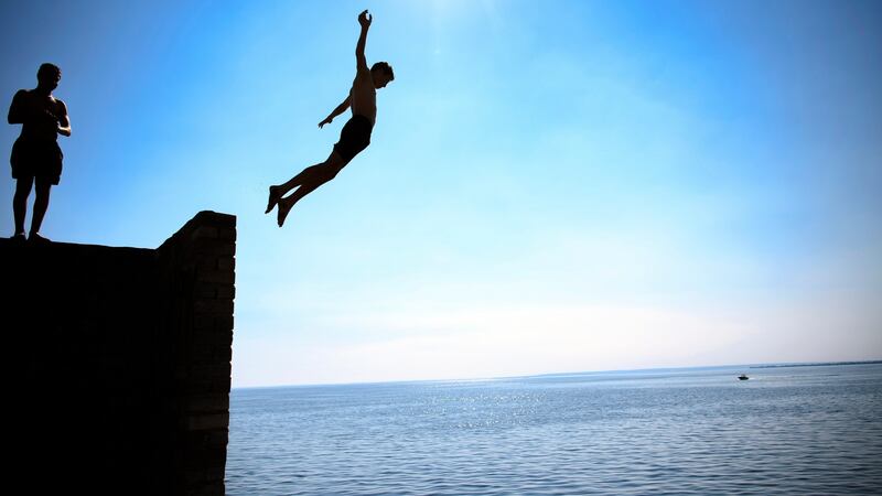 Local residents jump into the Volga river as they enjoy the warm weather in Togliatti, Russia. Photograph: Laurent Gillieron/EPA