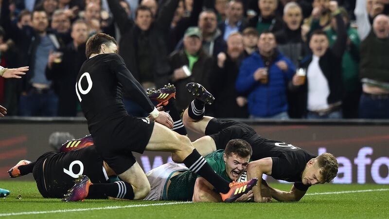 Jacob Stockdale scores against New Zeal last November.