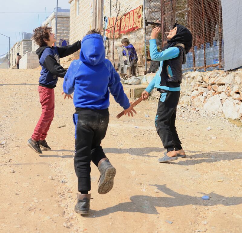 Hamoud’s children are playing in the displacement camp where the family has lived for over a year. Idleb, Syria. February 2024