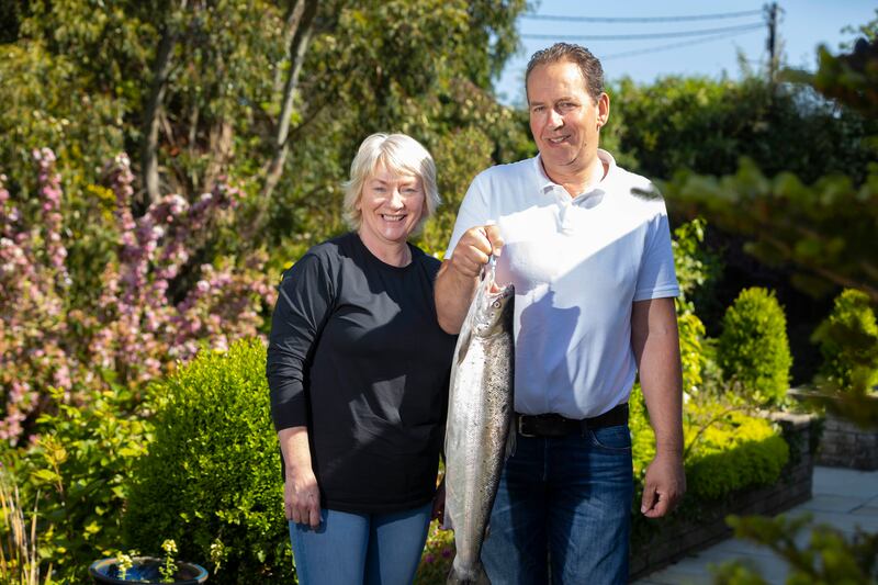 Lee and Kai Ronan. Kai holds a wild salmon weighing 8lb. Photograph: Patrick Browne