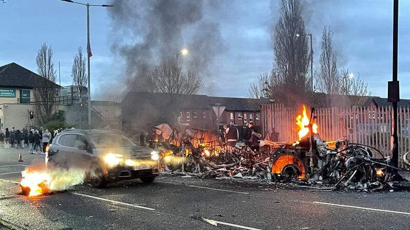 The wreckage of a bus on fire on the Shankill Road in Belfast. Photograph: Liam McBurney/PA Wire