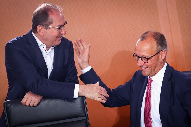 German chancellor Friedrich Merz (right) and his interior minister Alexander Dobrindt. Photograph: Christian Mang/Getty Images