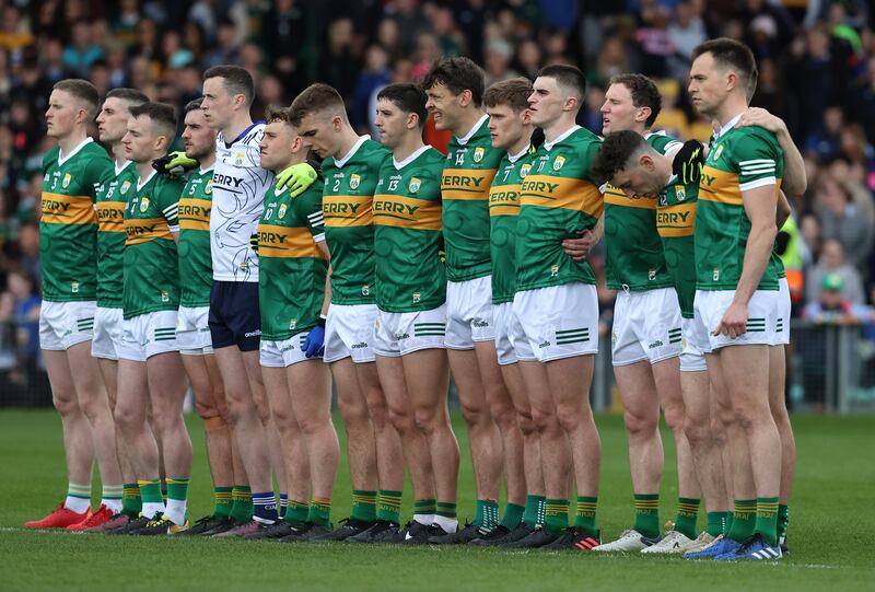 The Kerry team stand for a minute's silence in memory of Ellen Clifford, mother of David and Paudie, before the Munster final in Limerick. 
Photograph: Bryan Keane/Inpho 