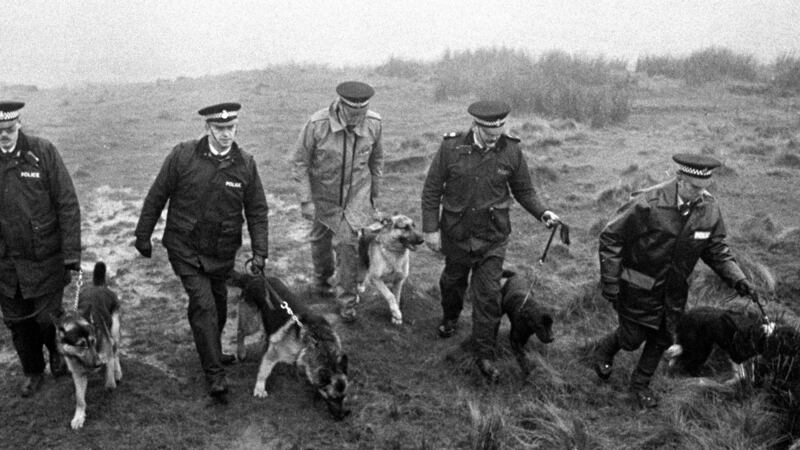 Police use specially trained sniffer dogs on Saddleworth Moor, near Oldham, in  1986, to search for Keith Bennett, one of the victims of moors murderer Ian Brady. Photograph: PA Wire