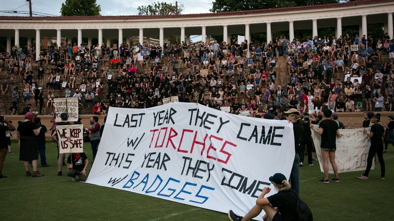 Activists rally at Lambeth Field on the campus of The University of Virginia one year after a torchlit rally of racists marched on campus in Charlottesville, Virginia. Photograph:  Logan Cyrus / AFP