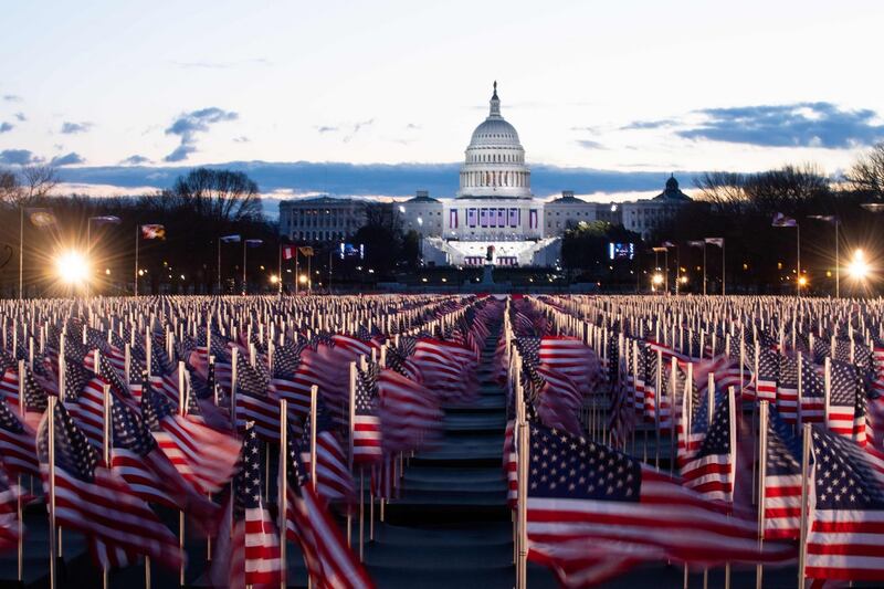 US flags are seen in the early morning  at the US Capitol in Washington. Photograph: Getty