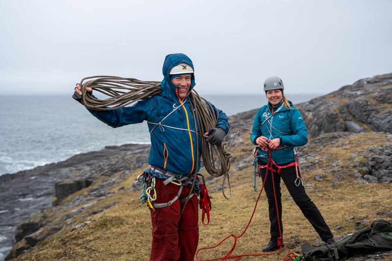 The pair gather their ropes and pack up, calling it a day as the weather closes in
