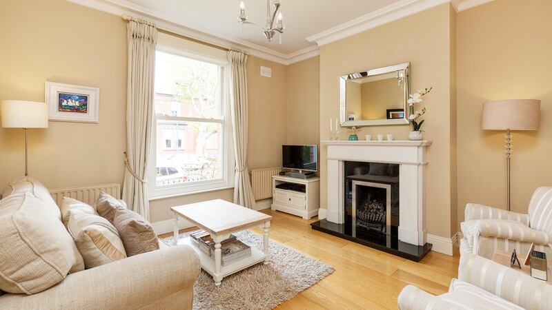 The bright living room at No 56 Hollybank Road.