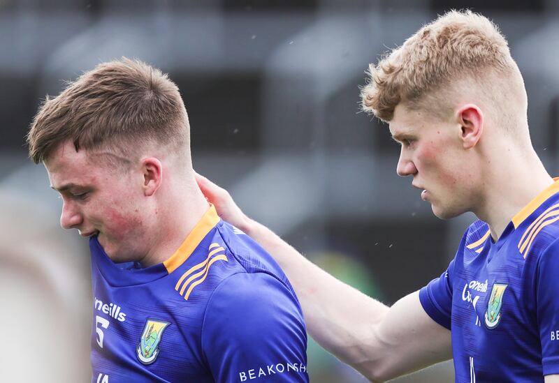 Wicklow's Matt Nolan is consoled by Kevin Quinn after the loss to Kildare. Photograph: Tom Maher/Inpho