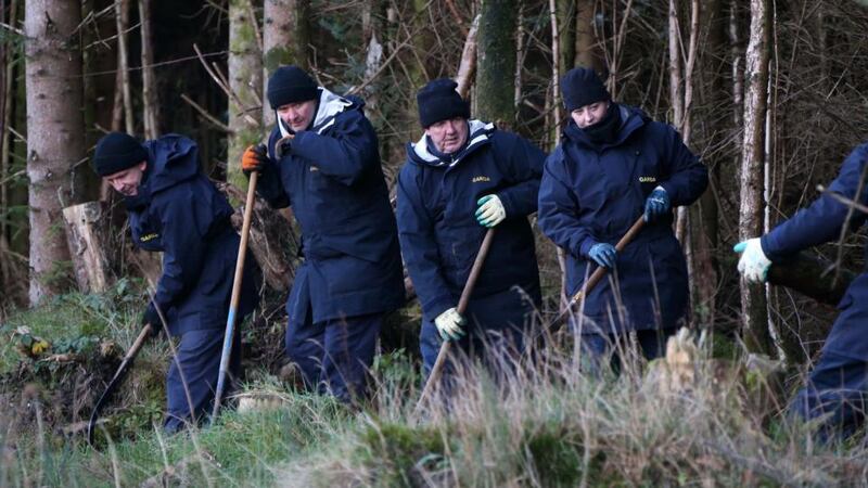 Fiona Pender: gardaí search woodland for the missing Offaly woman in 2014. Photograph: Colin Keegan/Collins