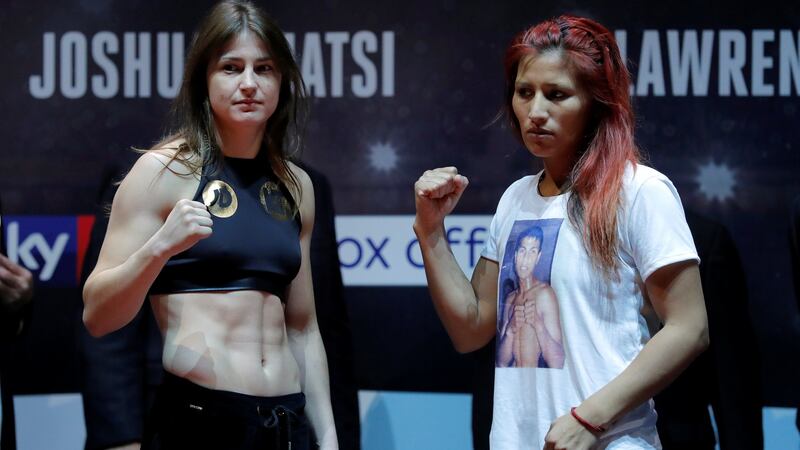 Katie Taylor and Anahi Esther Sanchez during the weigh-in. Photograph:  Andrew Couldridge/Reuters