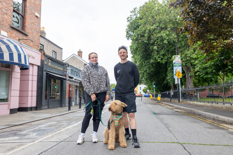 Siblings Laura Mahon and Ronan Mahon, with airedale terrier Dennis, on Sandymount Green on Friday. Photograph: Tom Honan/The Irish Times