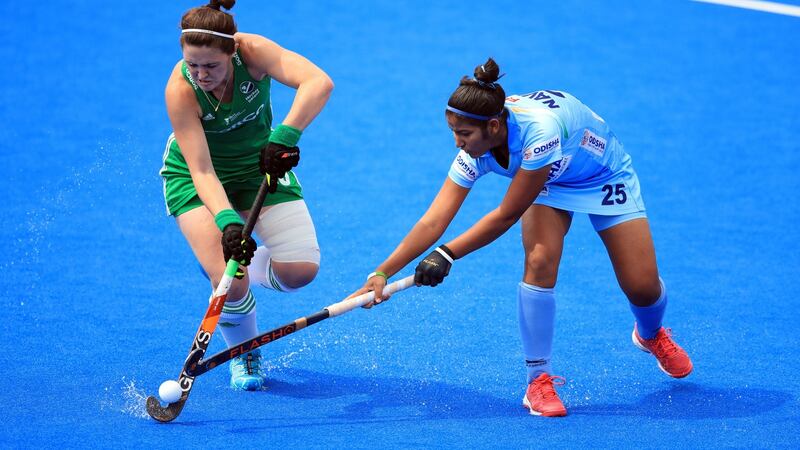 Ireland’s Róisín Upton in action against India’s Navneet Kaur. Photograph:   Adam Davy/PA Wire
