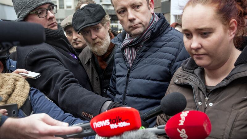 Glen Hansard and Brendan Ogle with Aisling Hedderman of the Irish Housing Network and one of the court injunctees photographed at Apollo House  after it was vacated. Photograph: Brenda Fitzsimons/The Irish Times