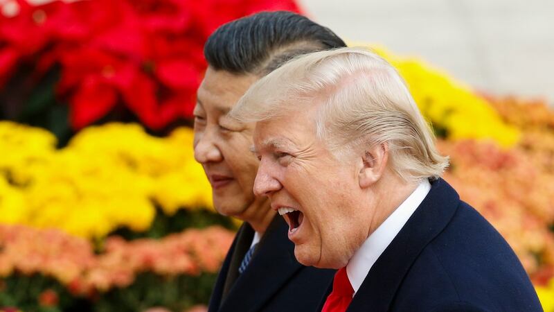 US president Donald Trump takes part in a welcoming ceremony with China’s president Xi Jinping  in Beijing during a 10-day trip to Asia. Photograph:  Thomas Peter-Pool/Getty Images.