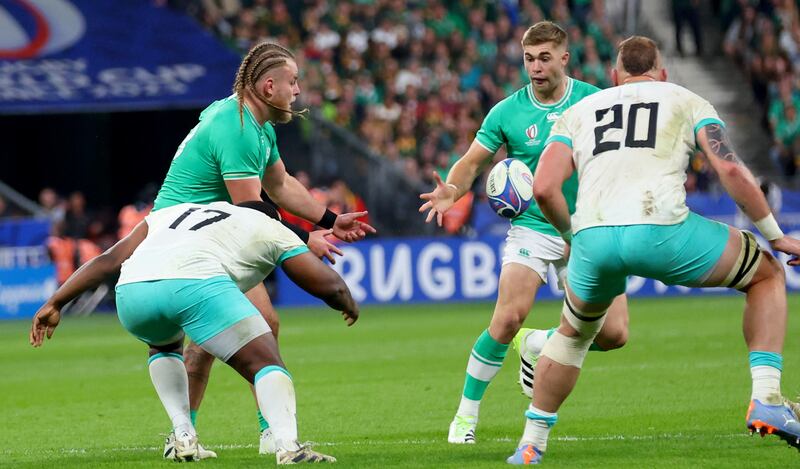 Ireland’s Finlay Bealham pops the ball to Jack Crowley before being tackled against South Africa. Photograph: James Crombie/Inpho