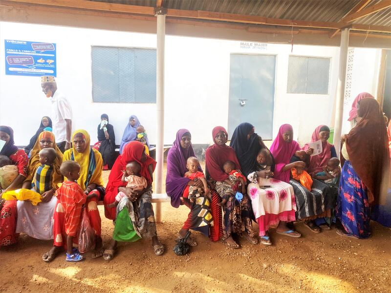 Mothers queue with their children at the Trócaire run outreach clinic in the Kabasa internally displaced camp in Dollow, Gedo, southern Somalia.