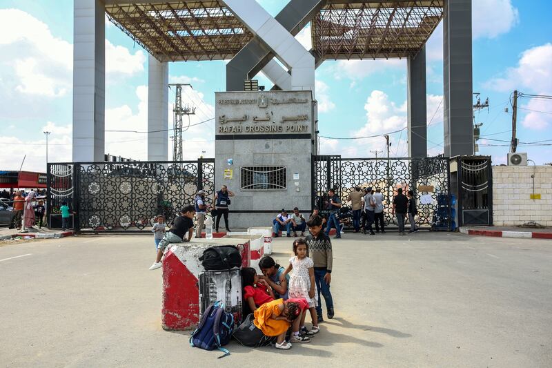 Palestinians and dual citizens at the Rafah border crossing with Egypt. Photograph: Samar Abu Elouf/The New York Times
                      