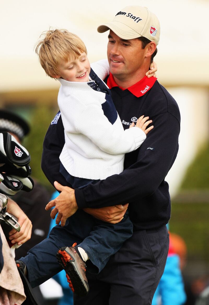 Padraig Harrington of Ireland walks off the 18th green with his son Patrick during the final round of the 2007 Open. Patrick famously asked if he could put ladybirds inside the Claret Jug. Photograph: Getty Images/Inpho
