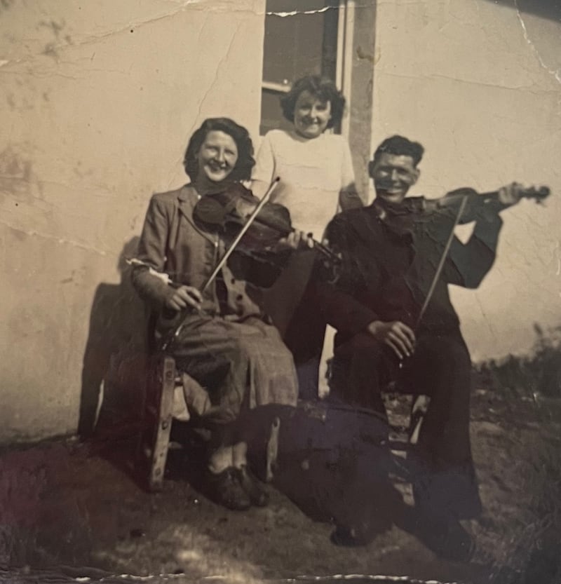 Left to right are Noreen Lynch, Bridget Lynch and Tom Hegarty in a historical photo from Kilfenora.