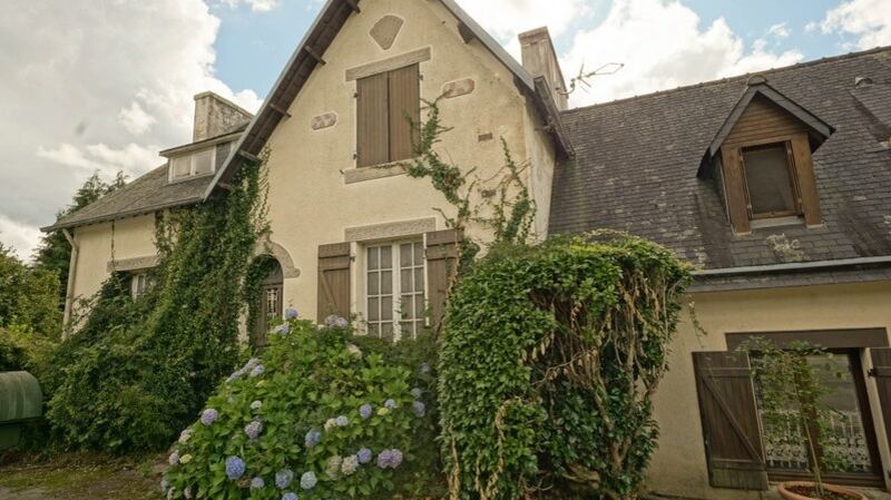 This old hostel in Finistere, Brittany  is  on one hectare of woodlands with a stream running through the land.