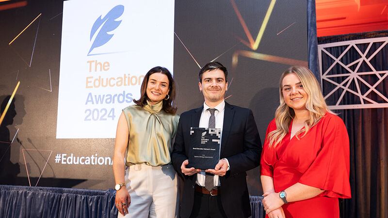 Lily Rowntree, entries lead at Business River, presents the best education outreach award to Shane O'Grady and Emma Whooley, Systems Biology Ireland & UCD