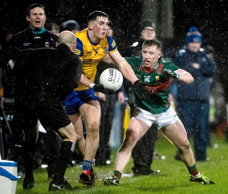 Mayo’s Ryan O'Donoghue and Roscommon’s Dylan Ruane in the  Division 1 game at MacHale Park. Photograph: Evan Logan/Inpho