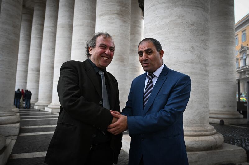 Israeli Rami Elhanan and Palestinian Bassam Aramin, who both lost their daughters in violence between Gaza and Israel few years ago, pose on March 27that St Peter's square in The Vatican after their meeting with Pope Francis. Photograph: Tiziana Fabi/AFP via Getty Images