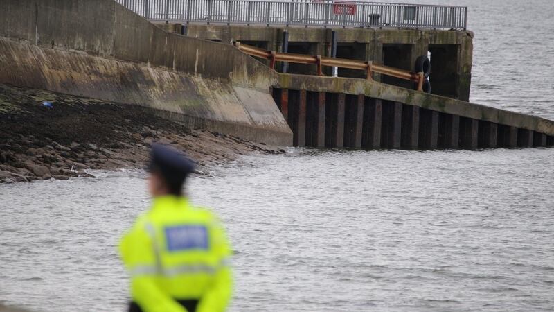 A garda looks at the slipway at the centre of the Buncrana tragedy. Photograph: Joe Boland/North West Newspix