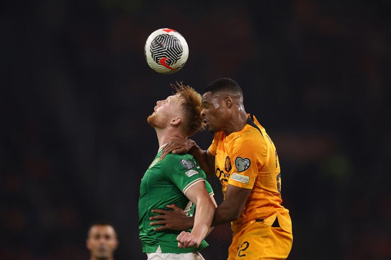 Liam Scales and Denzel Dumfries compete for the ball in the air. Photograph: Dean Mouhtaropoulos/Getty Images