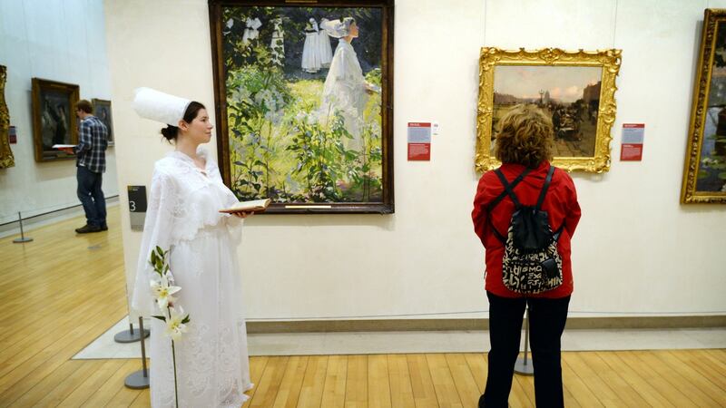 Sinéad O’Brien dressed as ‘A Convent Girl’ from a painting by William Leech (in background) as part of Paintings Come to Life in 2013. Photograph: Alan Betson