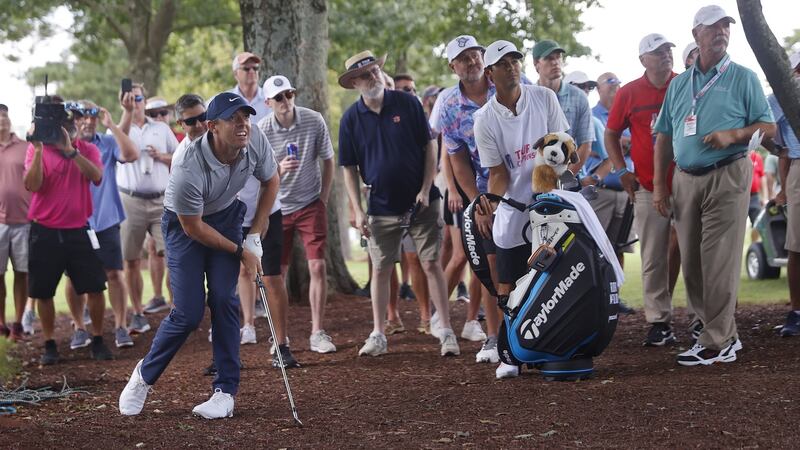Rory McIlroy  watches his ball after hitting from the trees  off the side of the fourth fairway during the first round of the Tour Championship at the East Lake Golf Club in Atlanta, Georgia. Photograph: Erik S Lesser/EPA