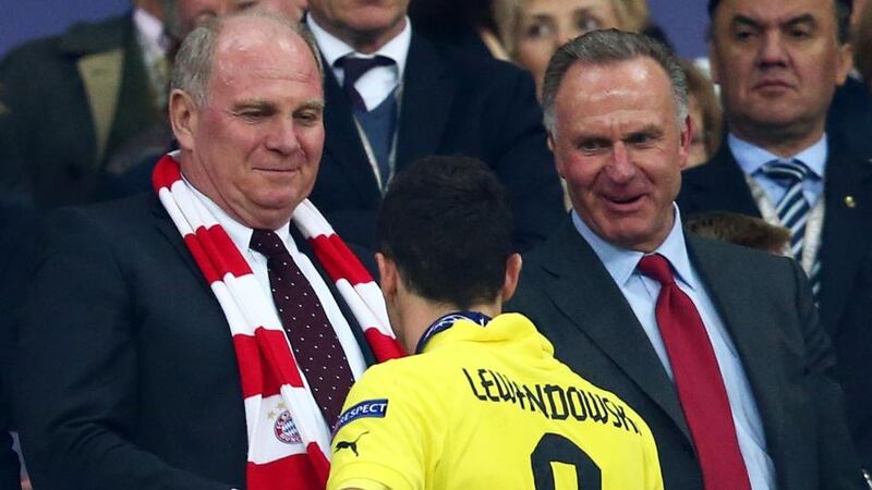President of Bayern Munich Uli Hoeness (left) offers his commiserations to Robert Lewandowski of Borussia Dortmund after losing the Uefa Champions League Final at Wembley Stadium. Photograph: Alex Grimm/Getty Images