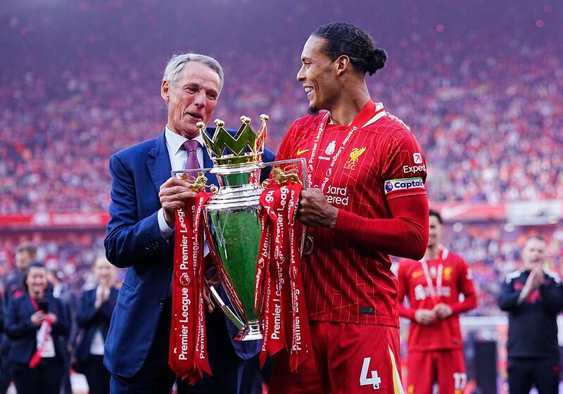 Liverpool's Virgil van Dijk and former Liverpool legend Alan Hansen celebrate with the Premier League trophy. Photograph: Peter Byrne/PA