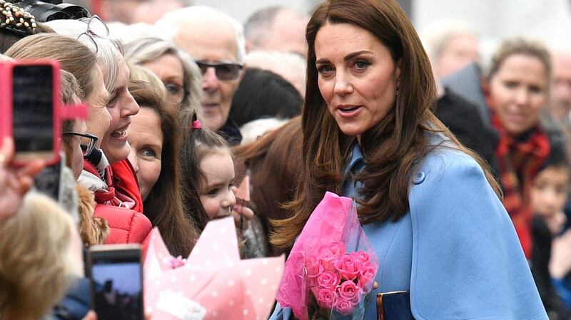 Catherine, Duchess of Cambridge meets members of the public as she arrives for a visit to the Braid Centre. Photograph: Neil Hall/EPA