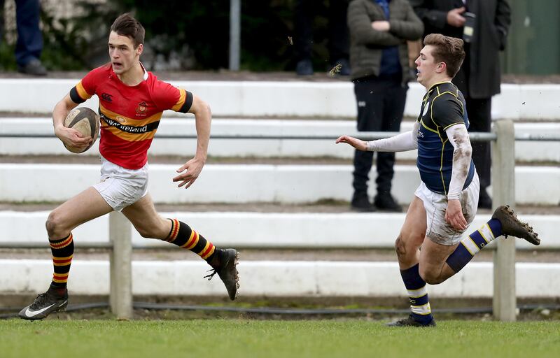 CBC's Eoghan Barrett on his way to scoring a try in the Munster Schools Senior Cup quarter-final against St Clement's College in February 2018. Photograph: Oisin Keniry/Inpho