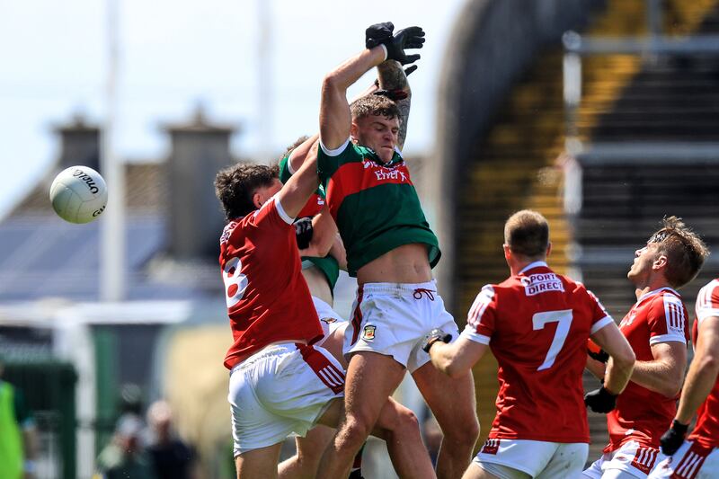 Cork's Colm O'Callaghan and Jordan Flynn of Mayo go up for a high ball during their All-Ireland Senior Championship game. Photograph: Evan Treacy/Inpho