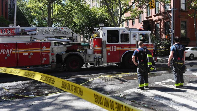 Fire fighters respond to a call in Brooklyn Heights after Isaias approached New York City on August 4th, 2020. Photograph: Angela Weiss/AFP via Getty Images