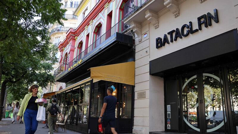 Pedestrians walk past the Bataclan theatre in Paris. Photograph: Thomas Coex/AFP via Getty