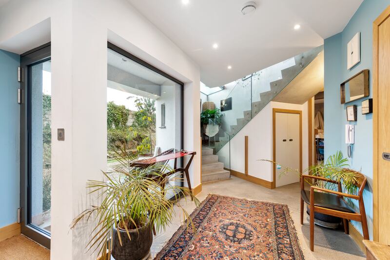 IO House has several floor-to-ceiling windows