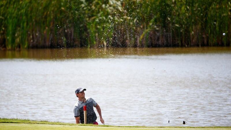 World number one Rory McIlroy plays a shot from the water’s edge on the fifth hole during the first round at Whistling Straits. Photograph: Jamie Squire/Getty Images.