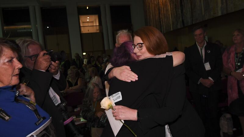 Former Australian prime minister Julia Gillard receives a kiss from an abuse victim during the National Apology to victims and survivors of Institutional Child Sexual Abuse at Parliament House. Photograph: EPA