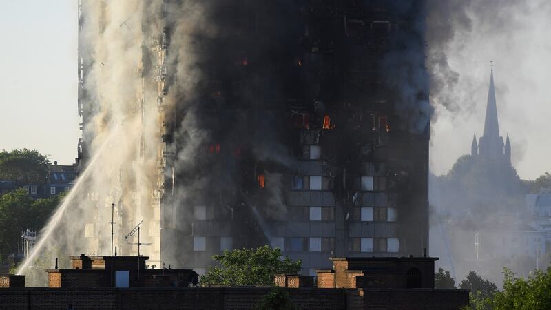 Flames and smoke billow as firefighters deal with a serious fire in a tower block at Latimer Road in West London, Britain June 14, 2017. Photograph: Toby Melville/Reuters