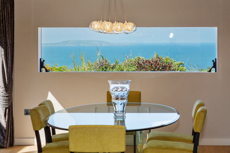 Picture window in the dining room frames Lambay Island