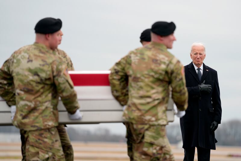 President Joe Biden joined grieving families to watch as the remains of three army reserve soldiers were returned to the US at Dover Air Force Base. Photograph: Matt Rourke/AP